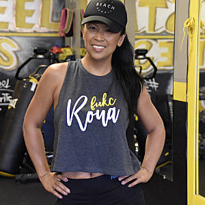 Woman in Grey Crop T-Shirt with Fukc cursive Logo